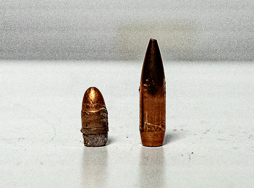 A pulled 22lr bullet next to a 223 bullet
