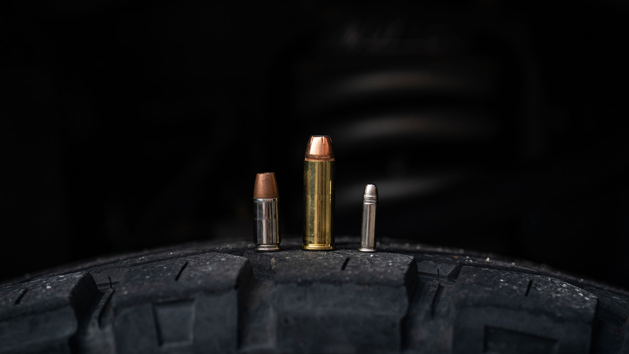 44 magnum self defense ammo next to smaller cartridges 44 Magnum next to 9mm and 22lr cartridges