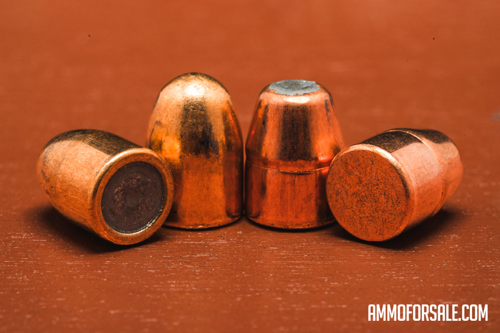 Brass enclosed base bullets displayed on a table