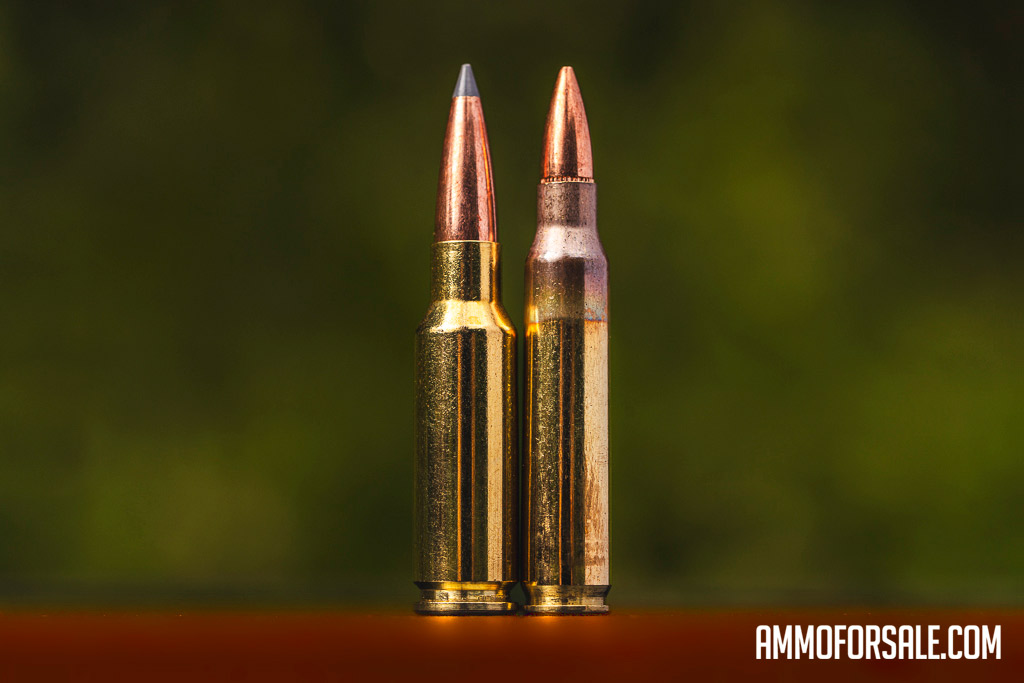 6.5 Creedmoor ammunition cartridge next to a 223 remington cartridge