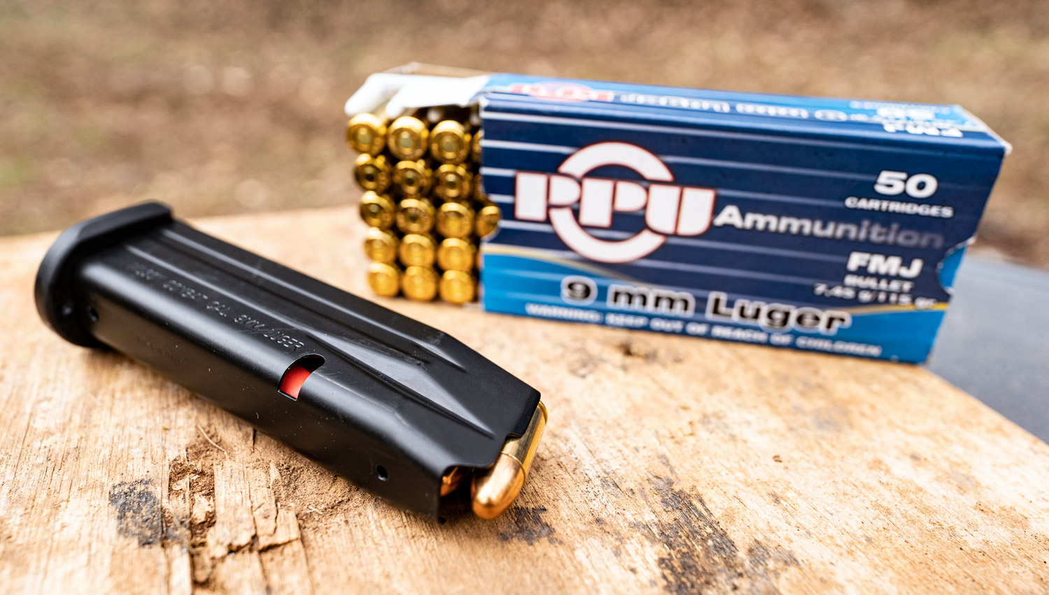 A double stack 9mm gun magazine with ammo
