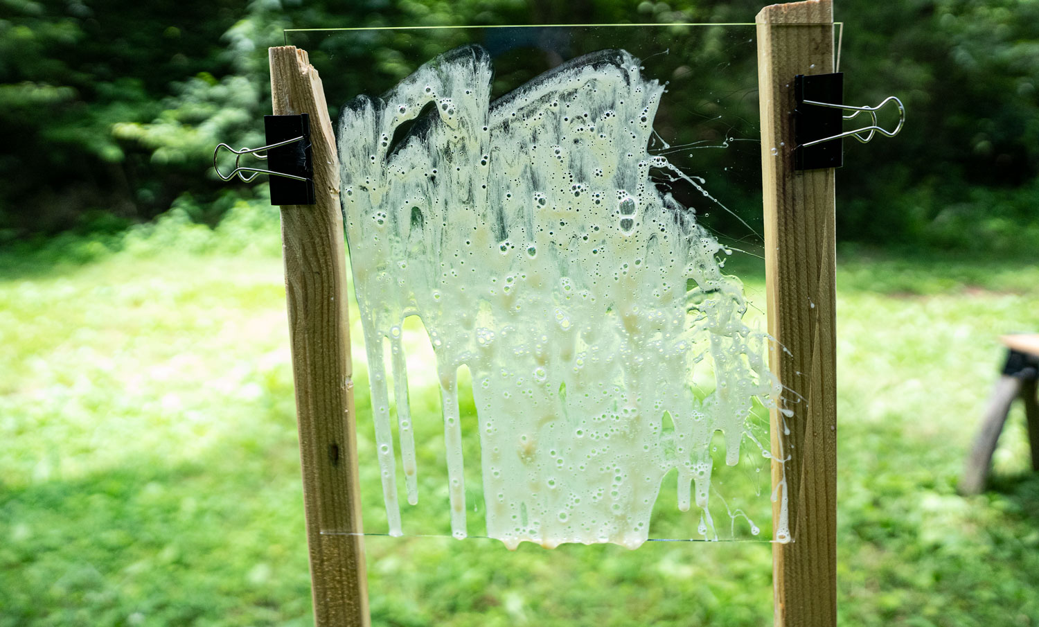 Pepper gel sprayed onto a clear window to show how it sticks