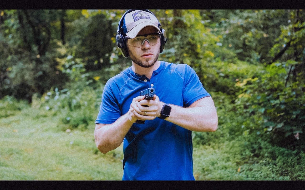 Author firing the Glock 21 at the range as part of his review.