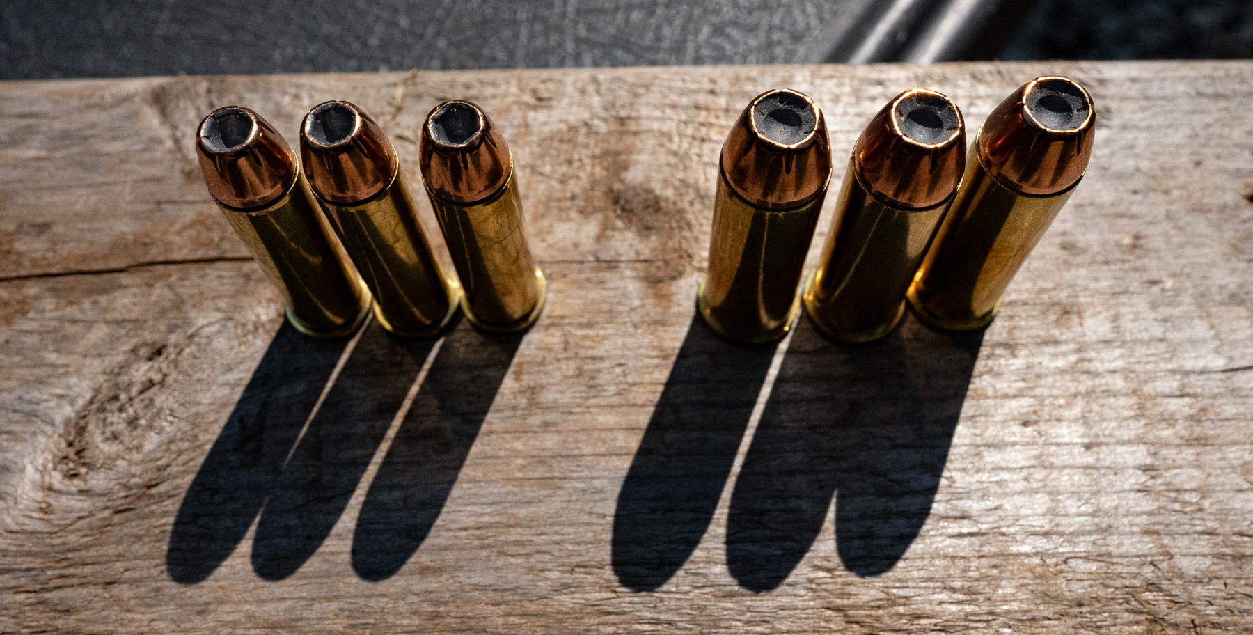 357 magnum vs 44 magnum ammo lined up on a table