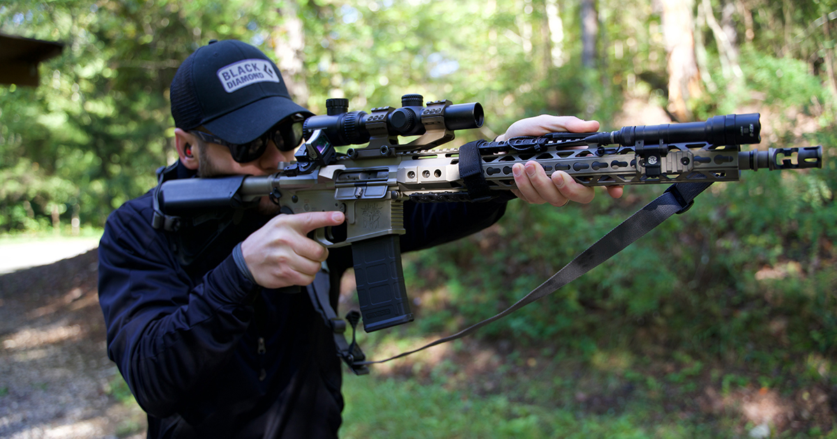 Shooting an AR-15 rifle at the range 