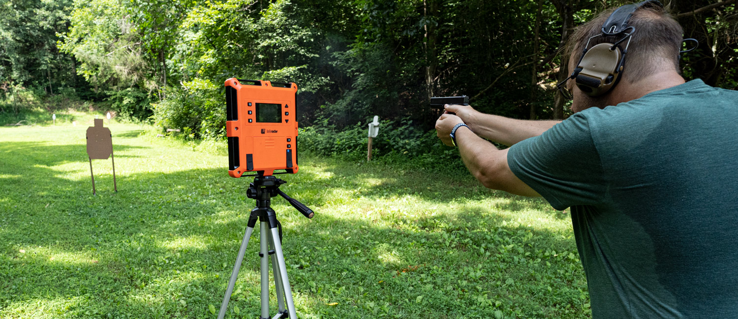 The author shooting syntech ammo with polymer coated bullets at a shooting range