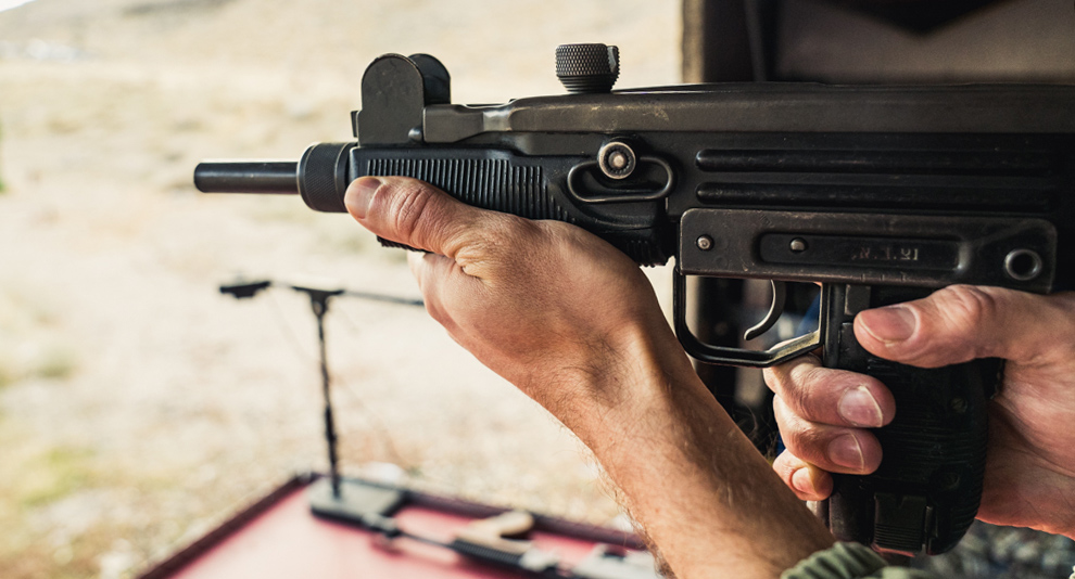 Firing an uzi at the range