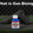 what is gun bluing with bluing liquid in front of a pistol